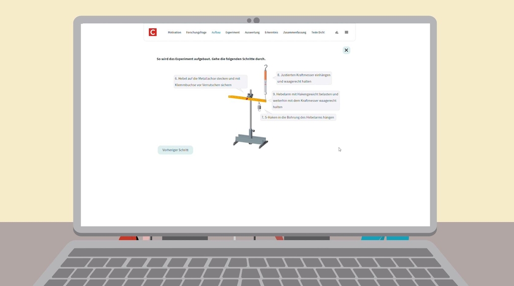 Gezeigt wird ein aufgeklappter, illustrierter Laptop wo ein Screen des eXperiScouts gezeigt wird. Gezeigt wird hier eine, durch durcklicken, eine genaue 3D-Aufbauanleitung zum gewünschten Versuch.