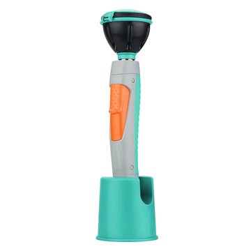 Das Bild zeigt ein Experimentiergerät mit einem ergonomisch gestalteten Griff in mintgrüner und grauer Farbe, das eine schwarze Sammelkammer an der Oberseite hat. Das Gerät ist in einer Halterung platziert und eignet sich für den Einsatz im Bildungsbereich.