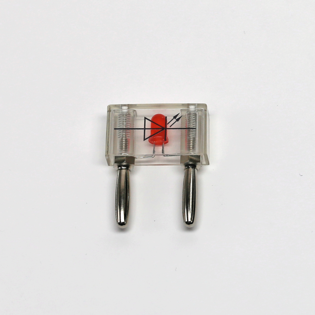 Das Bild zeigt ein transparentes Versuchsgerät mit einer roten Diode und zwei Metallstiften. Es dient wahrscheinlich zur Veranschaulichung von elektrischen Komponenten im Bildungsbereich.