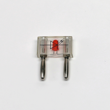 Das Bild zeigt ein transparentes Versuchsgerät mit einer roten Diode und zwei Metallstiften. Es dient wahrscheinlich zur Veranschaulichung von elektrischen Komponenten im Bildungsbereich.